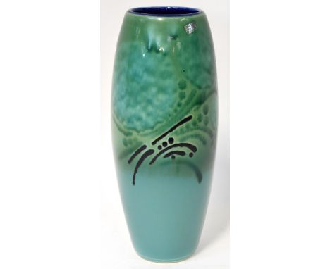 Alan Clarke; a tall cylindrical vase with jade green ground and designs in green and black in the Oriental style, initialled 