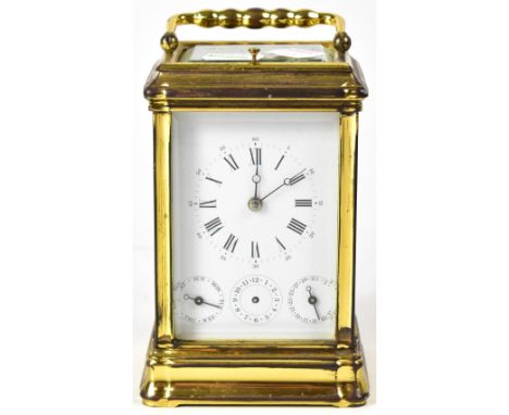 A 20th century French brass carriage clock, the enamelled dial set with Roman and Arabic numerals, with three secondary dials