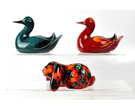 POOLE; a flambé 'Delphis' duck (af), length 17cm, a green ground and black feathered and beak duck, and a flambé rabbit, init