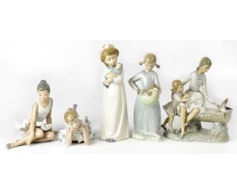 Five Nao figures comprising two ballerinas, two little girls in nightdresses, and a mother and daughter on a bench feeding pi