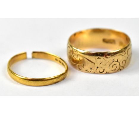An 18ct gold wedding band with engine turned decoration, stamped 18, size P1/2, approx 4.8g, and a 22ct gold wedding band (cu