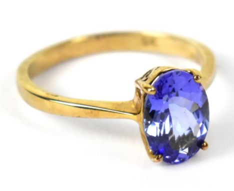 A 9ct yellow gold dress ring with oval faceted tanzanite, size R, approx 2.6g.