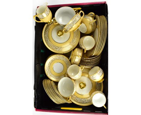 SHELLEY; a part dinner service of yellow ground with a cream band and gilt printed trailing flower decoration and gilt highli