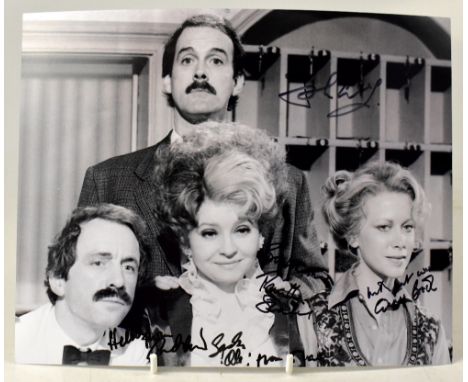 FAWLTY TOWERS; a black and white photograph bearing the signatures of the four stars, 20.5 x 25.5cm.We have not authenticated