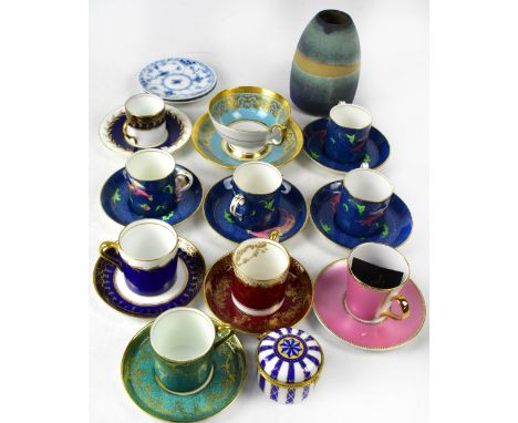 A group of cabinet coffee cups and saucers to include a set of four Crown Staffordshire examples, Rd No 705621, blue mottled 