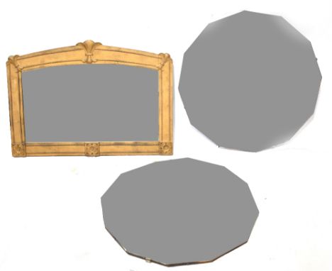 A 1930s twelve-sided peach glass mirror with bevelled edge, together with a similar clear glass example, each 62 x 61cm and o