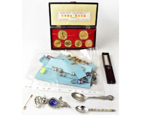 Various items of costume jewellery to include tie pins, brooches, pendant, silver spoon, a quantity of fashion earrings and a