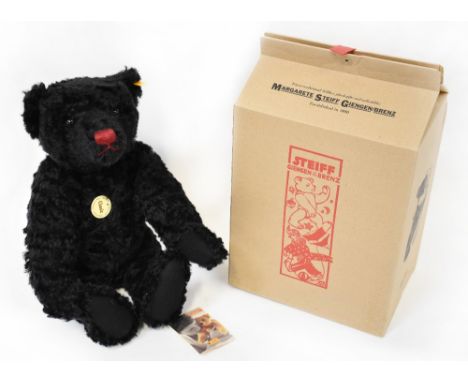 STEIFF; a modern black mohair Steiff Classic teddy bear no.005985, with button in ear and tags, length 43cm, in original box.
