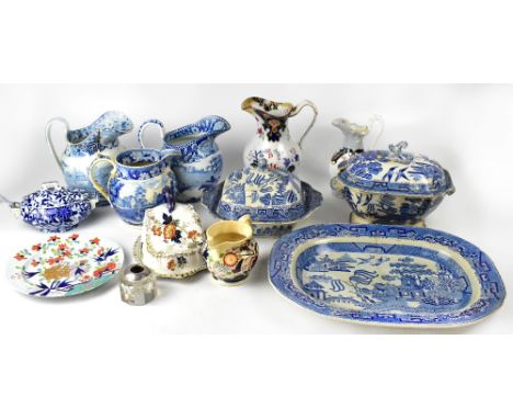 Various 19th century and later blue and white ceramics to include a large Willow pattern meat dish and covered tureens, a jug