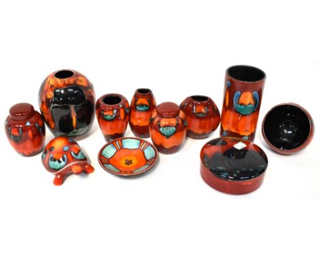 POOLE; a group of eleven ceramics, 'Volcano pattern', a cylindrical vase, height 17cm, two miniature ginger jars, a purse vas