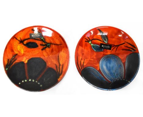 POOLE; two shallow dishes, both in the 'Himalayan Poppy' design, varying colourways, diameter 27cm, both boxed (2).