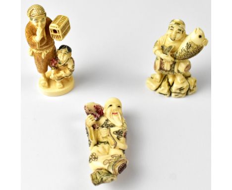 Three Japanese netsuke comprising a fisherman holding up a fish, another with a fish on his shoulder, unsigned, and a man hol
