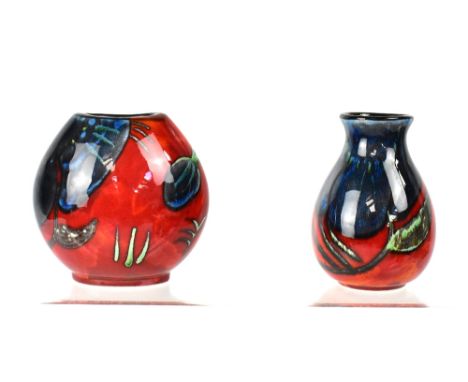 POOLE; a small purse vase, height 11cm and a squat baluster vase, height 11cm, both in the 'Himalayan Poppy' design, initiall