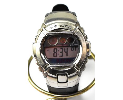 CASIO; a gentlemen's 'G-Shock' digital sports watch, modern G-3110, with stainless steel back and rubber strap. CONDITION REP