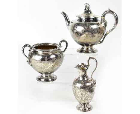 A Victorian hallmarked silver three piece tea service comprising teapot with centurion helmet finial, milk jug and large suga