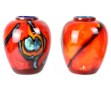 POOLE; two non-matching baluster vases, 'Peacock' design, one red and burnt orange ground with black feather decoration, pale