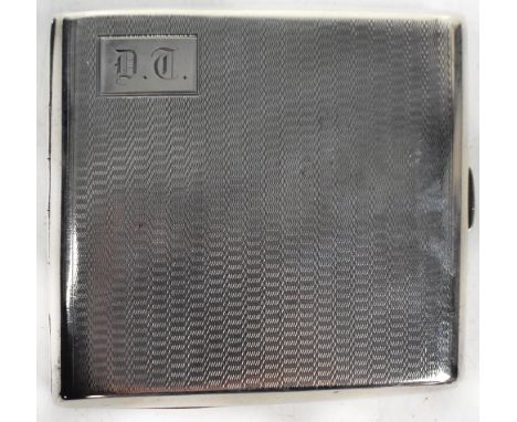 A George V hallmarked silver breast pocket cigarette case, with elasticated strap to each inner side, the exterior with engin