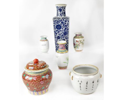 A group of six Oriental ceramics to include a large blue and white floral decorated vase, height 35cm, a set of three Chinese