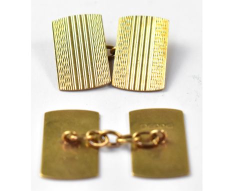 A pair of gentlemen's vintage hallmarked 9ct gold square cufflinks, each with engine turned striped decoration, united by sma