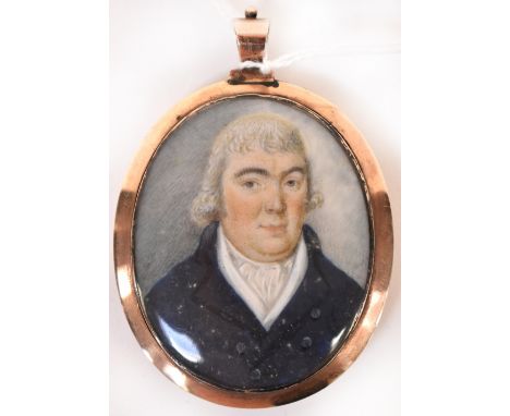 A 19th century yellow metal double portrait pendant, the oval pendant with a watercolour depicting a portrait of a blue coat 