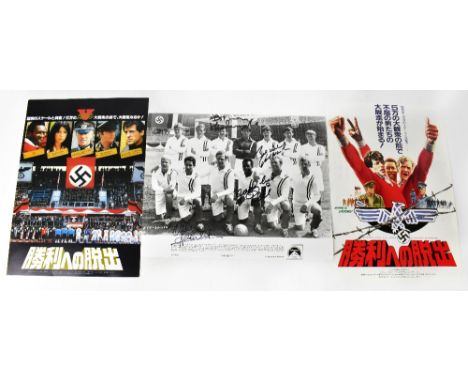 ESCAPE TO VICTORY; a black and white reproduced photograph of the actors and football stars posing as the team line-up, beari