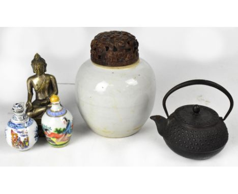 A small collection of Oriental items to include a 19th century Dehua -style ginger jar with associated 19th century wooden co