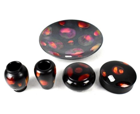 POOLE; five pieces in the 'Galaxy' pattern, black iridescent ground, a large shallow dish, diameter 27cm, a powder box, diame