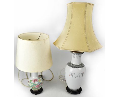 An Oriental-style baluster table lamp with bands of brown abstract decoration to the top of the body above delicately painted