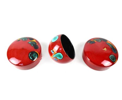 POOLE; a pair of powder boxes in the 'Odyssey' design, diameter 14cm and a decorative ball, also in the 'Odyssey' design (3).