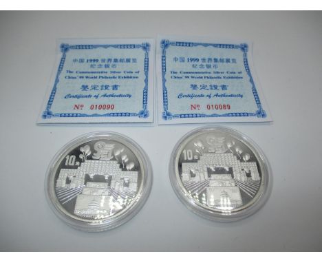 Two 1999 Chinese 10 Yuan Bu Silver 99.9 One Ounce Coins, Commemorates 99 World Philatelic Exhibition, coins are capsulated wi