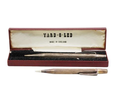 Two silver Yard 'o' Led propelling pencils within fitted case with papers. Both with engine turned decoration, one hallmarked