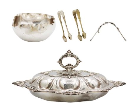 A silver plated lidded tureen by Walker & Hall, and other plated wares. The oval lobed tureen with foliate and strapwork cast