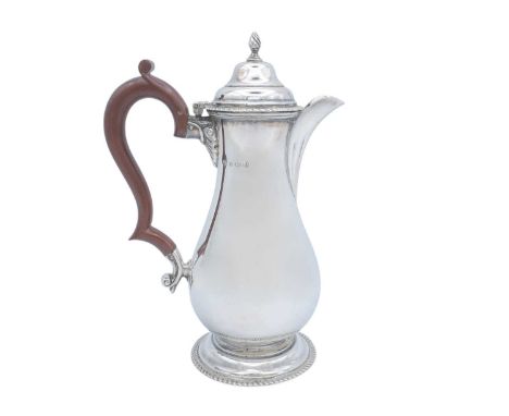 A George V silver baluster coffee pot by S Blanckensee & Son Ltd. With gadrooned decoration and bakelite handle, Birmingham 1