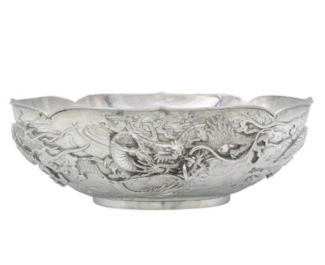 A good Meiji period Japanese silver double walled dragon bowl by Musashiya, Yokohama. The oval bowl decorated in high relief 