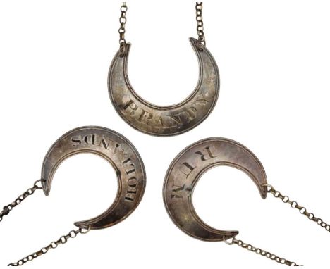 A George III silver set of three crescent-shaped spirit labels by Phipps, Robinson & Phipps. London 1814, inscribed 'BRANDY',
