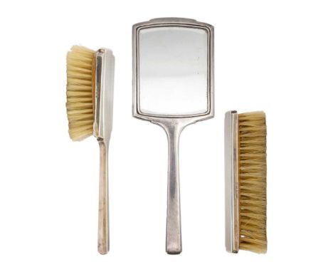 A modern silver engine turned three-piece dressing table set by Deakin & Francis Ltd. Comprising hand mirror, hair and clothe