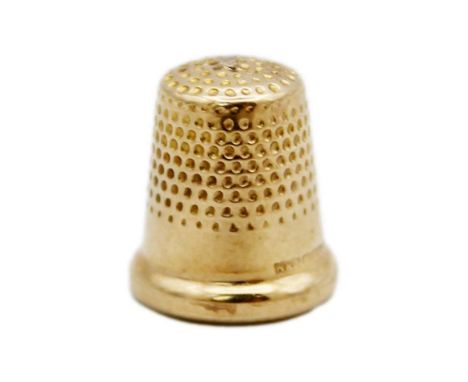 A tiny 9k hallmarked gold child's thimble by W H Collins & Co. Birmingham 1947, length 13mm, 1.1g.