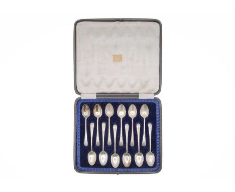 A George V silver set of twelve teaspoons by J Rodgers & Sons Ltd. With engraved handles and within fitted box, Sheffield 192