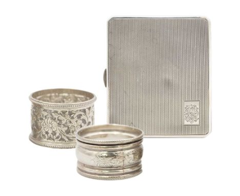 A George V silver engine turned cigarette case by Walker & Hall, and two silver napkin rings. The cigarette case hallmarked C