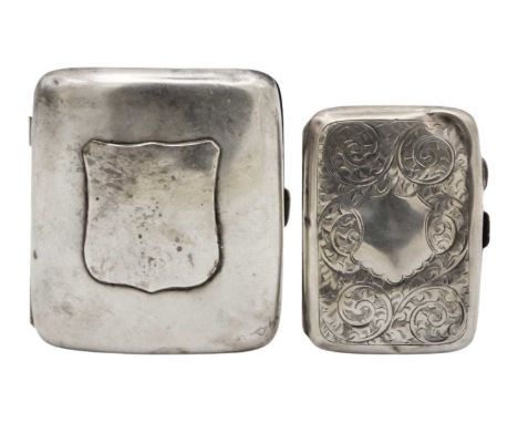 A Victorian silver cigarette case and a George V silver cigarette case. The Victorian case of curved form, vacant shield cart