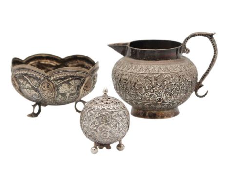 Three 19th-century Indian silver items. To include an ovoid cream jug with leaf scroll repousse decoration, height 8cm; a sug
