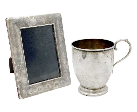 A white metal (tests as silver) pedestal cup, and a modern silver-mounted photograph frame. The cup with loop handle, height 