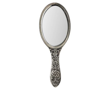 A Victorian silver embossed hand mirror by Charles Stuart Harris. London 1895, length 28.5cm.