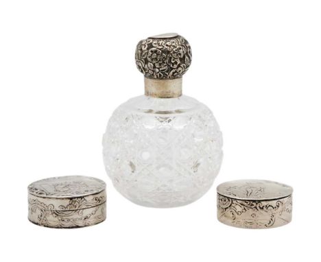Two similar 19th-century Dutch 800 silver hinged pill boxes, and a scent bottle. The boxes with figural repousse scenes to th