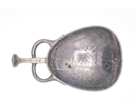 An Edwardian Art & Crafts silver caddy spoon by Albert Edward Jones. Birmingham 1931, hammered finish, length 7cm, width 4.2c