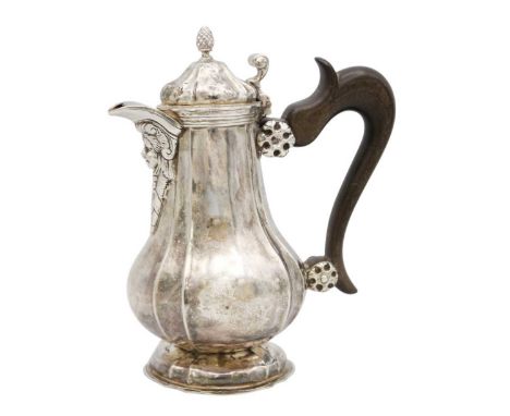 A mid-18th-century continental, possibly Maltese, silver coffee pot. Of fluted baluster form with pineapple finial to the dom