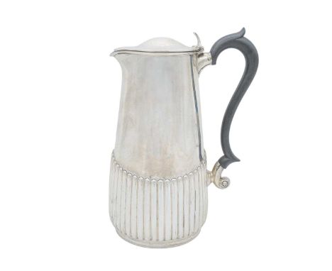 A George V silver half-fluted hot water pot by Manoah Rhodes & Sons Ltd. With ebonised handle, Sheffield 1926, height 22cm, 1