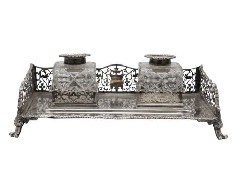A Victorian silver desk stand by William Hutton & Sons Ltd. Of rectangular form with gadrooned edging and pierced gallery, tw