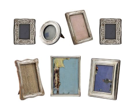 A selection of seven silver applied photograph frames. Including one small circular frame, Birmingham 1909, by W I Broadway &