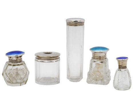 A selection of five silver top glass dressing table bottles, three with enamel. To include a small scent bottle with blue gui